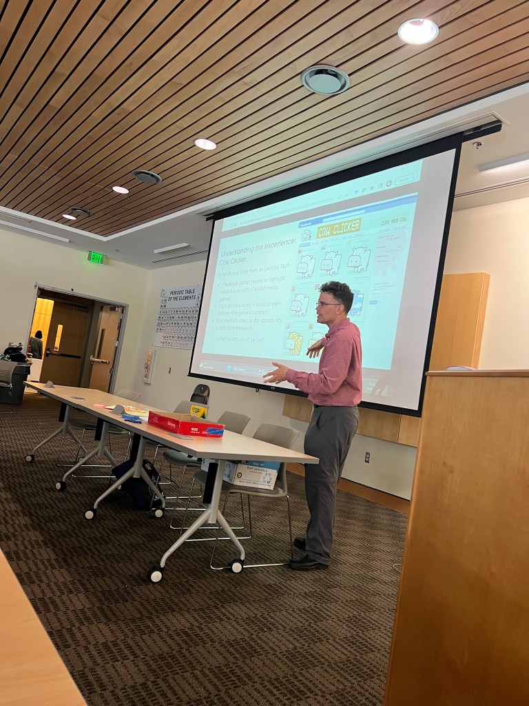 Workshop organizer Dr. Scott McCrickard makes a point about a game